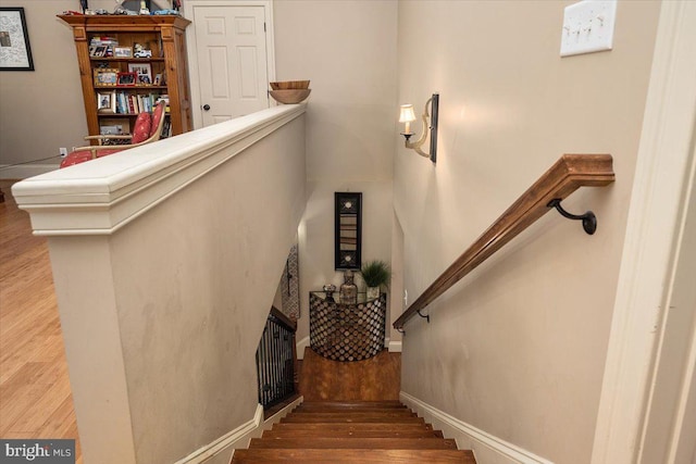 stairs with wood-type flooring