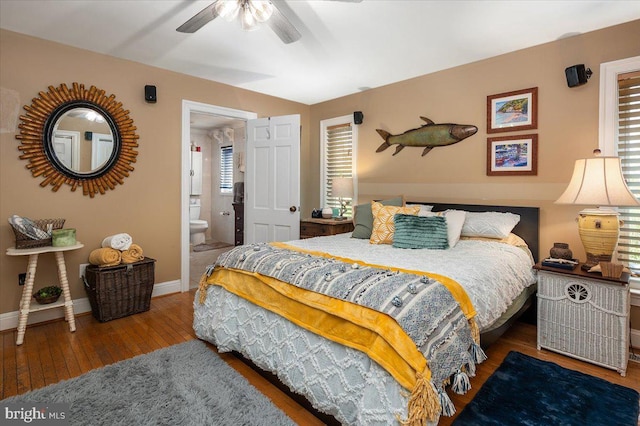 bedroom featuring connected bathroom, ceiling fan, and wood-type flooring