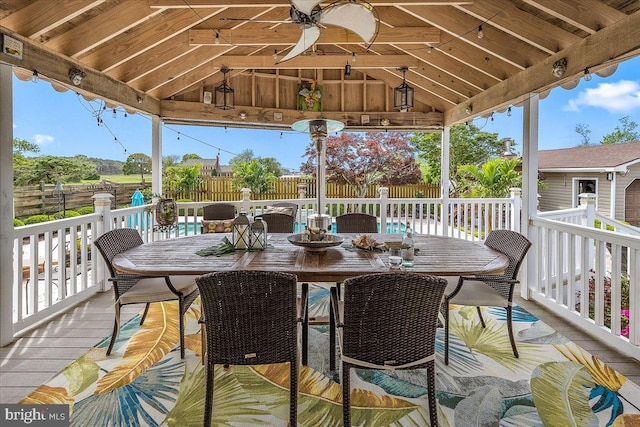 wooden deck featuring a gazebo and ceiling fan