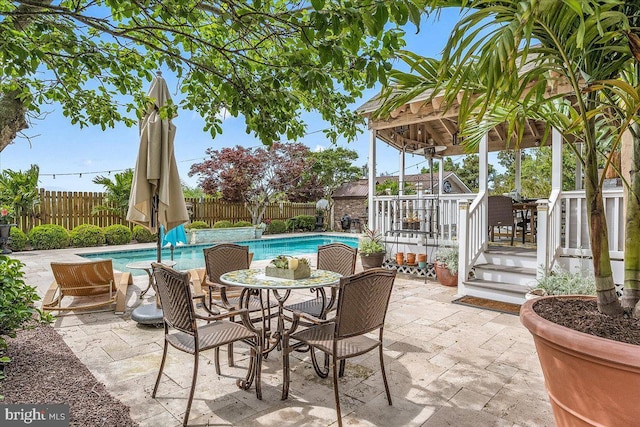 view of patio / terrace with a pool side deck