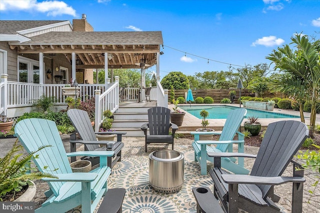 view of patio / terrace with a fenced in pool