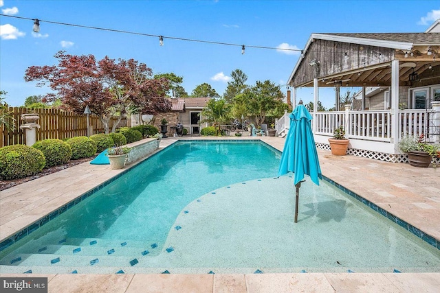 view of swimming pool featuring a patio