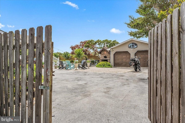 exterior space with a garage and an outdoor structure