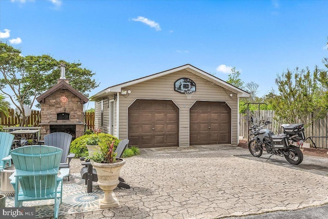 garage featuring an outdoor fireplace