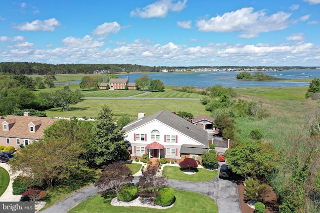 birds eye view of property featuring a rural view and a water view