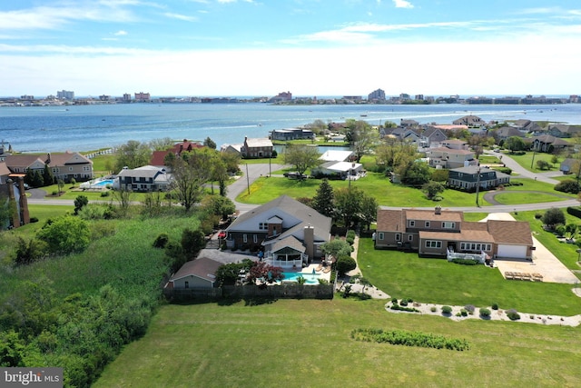 birds eye view of property featuring a water view