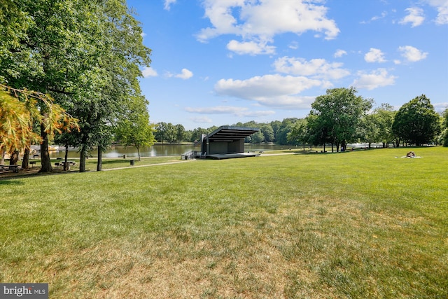 view of yard featuring a water view and a carport