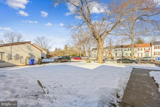 view of yard layered in snow