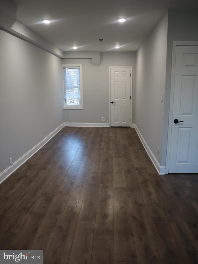 basement featuring dark wood-type flooring