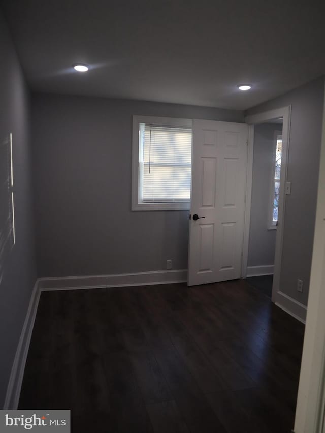 empty room featuring dark hardwood / wood-style floors