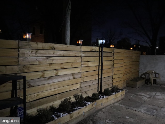 view of gate at twilight