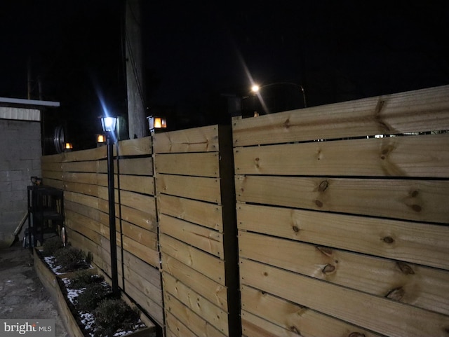 view of gate at twilight