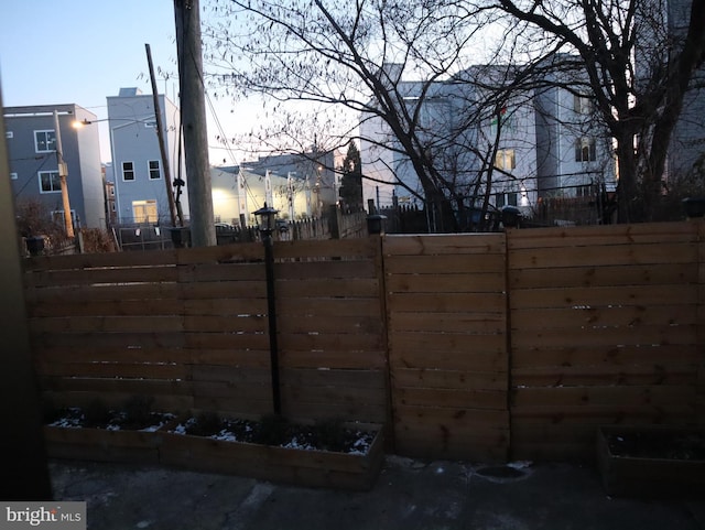 view of gate at dusk