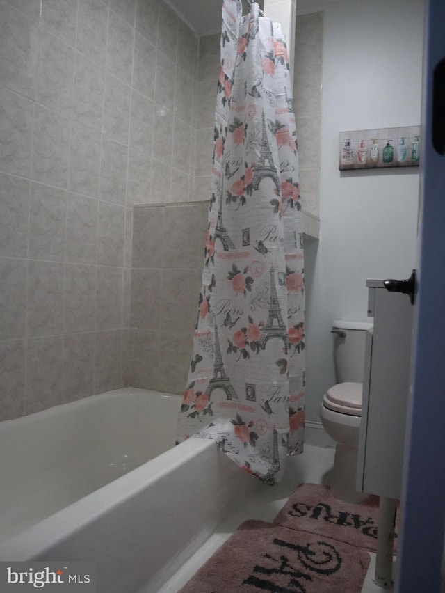 bathroom featuring shower / bath combo and toilet