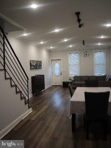 dining room with dark wood-type flooring