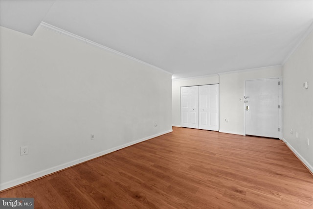 interior space with light wood-type flooring and ornamental molding