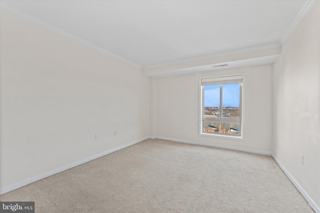 unfurnished room featuring ornamental molding and light colored carpet