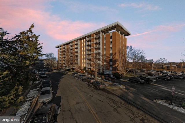 view of outdoor building at dusk