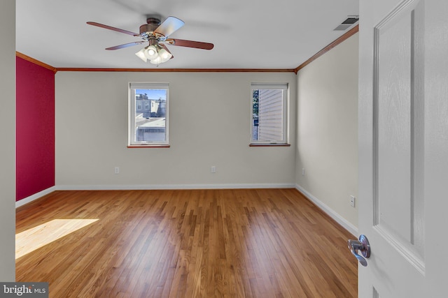 unfurnished room with light hardwood / wood-style floors, ceiling fan, and ornamental molding