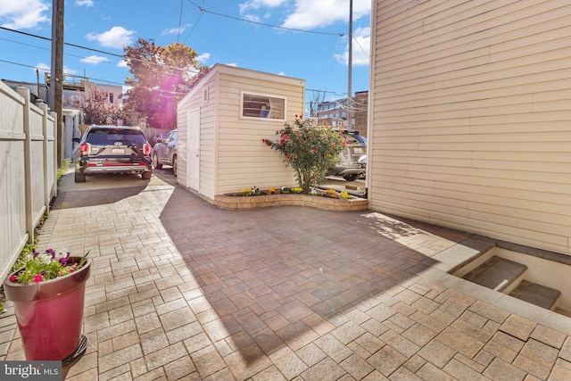 view of patio / terrace with an outbuilding