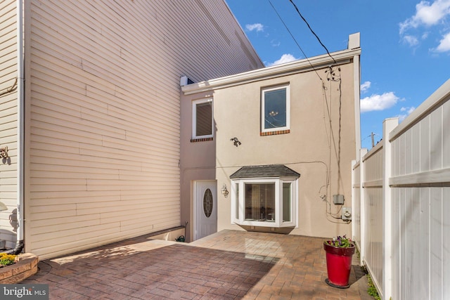 back of property featuring a patio area