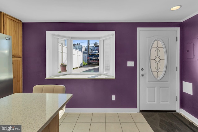 entryway featuring light tile patterned flooring