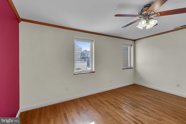 unfurnished room with light hardwood / wood-style floors, ceiling fan, and crown molding