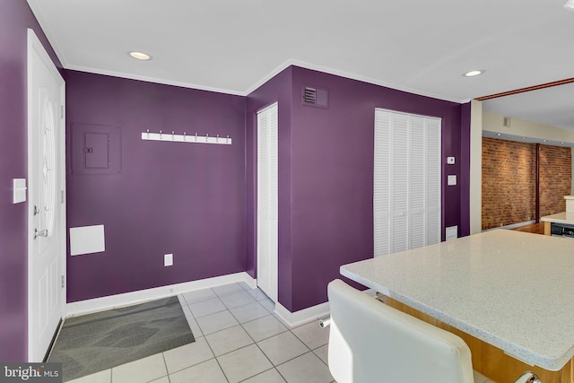 kitchen featuring light tile patterned flooring and electric panel