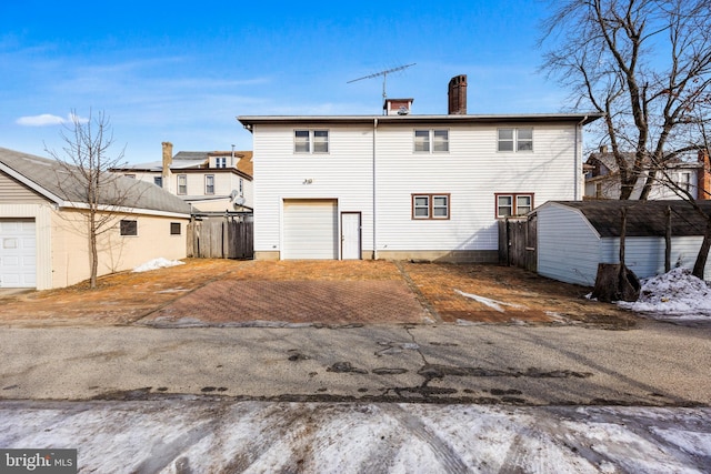 back of property featuring a carport