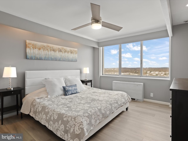 bedroom featuring light wood-type flooring and ceiling fan