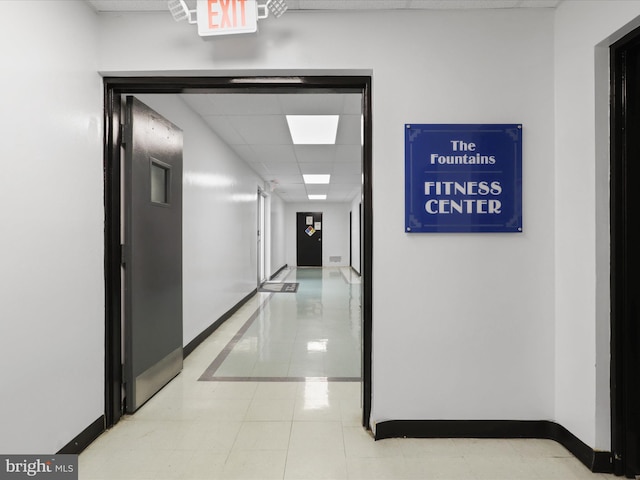 hall featuring light tile patterned floors