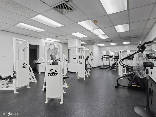 gym featuring a drop ceiling