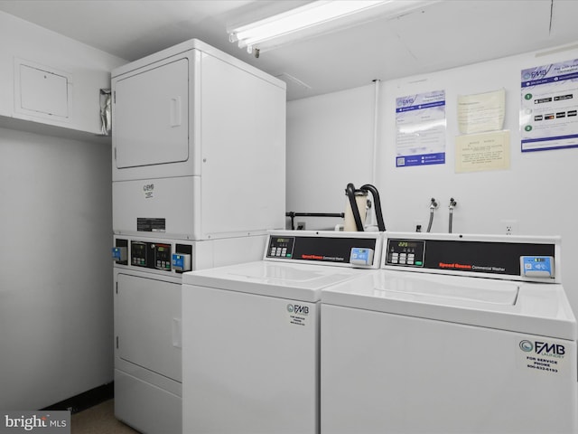 laundry area with separate washer and dryer and stacked washer and clothes dryer