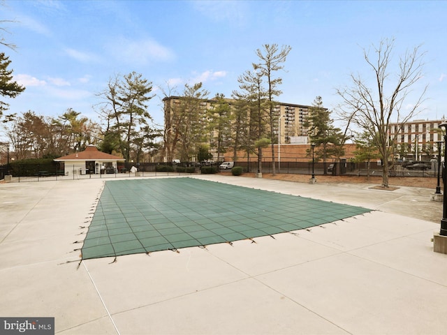 view of swimming pool with a patio