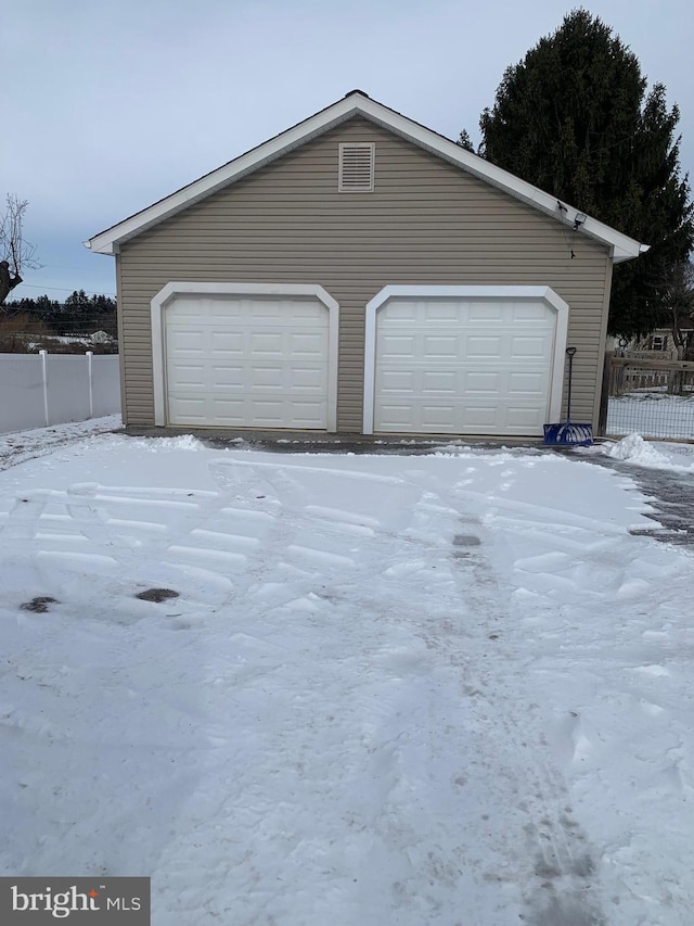 view of snow covered garage