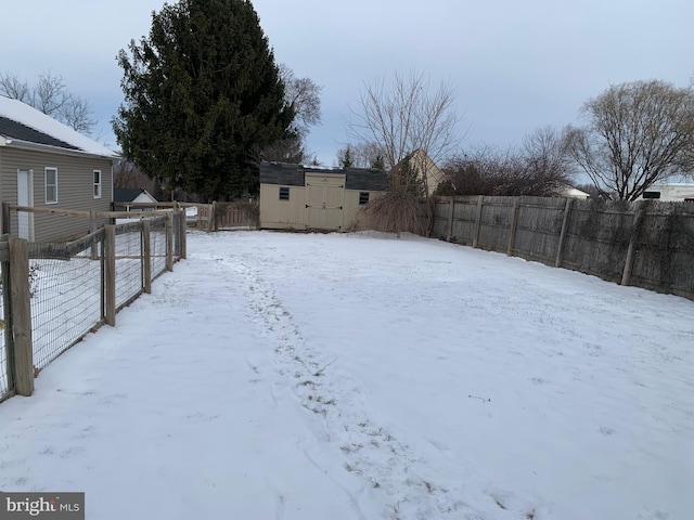 view of yard layered in snow