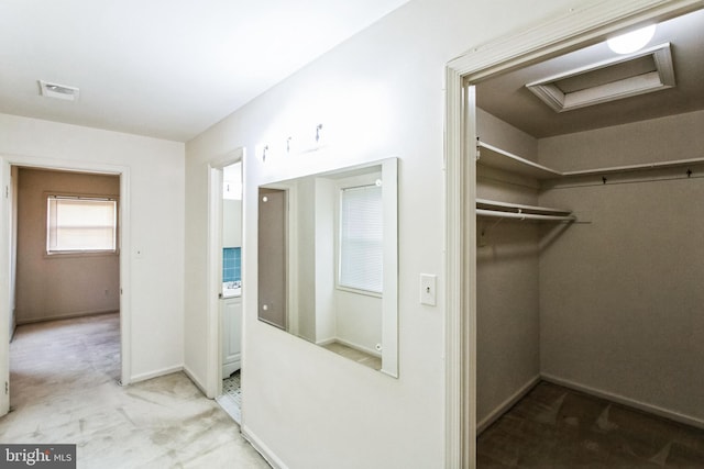 interior space featuring attic access, carpet, and visible vents