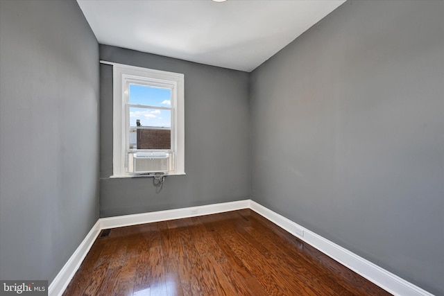 spare room with wood-type flooring and cooling unit