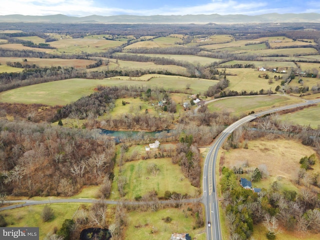 birds eye view of property with a mountain view