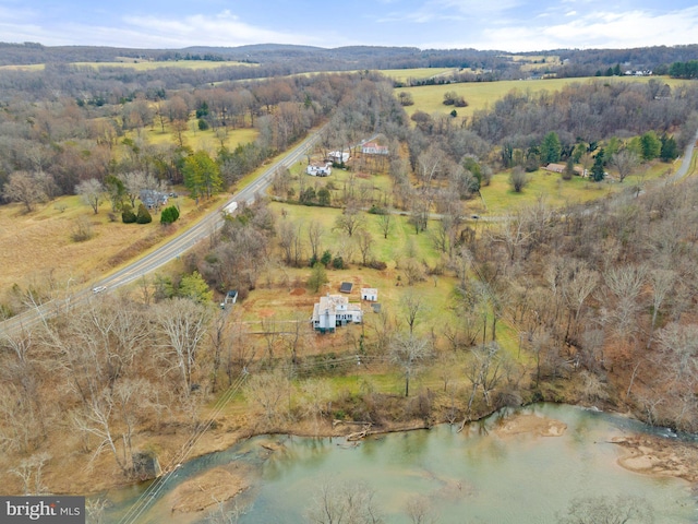 aerial view with a rural view and a water view