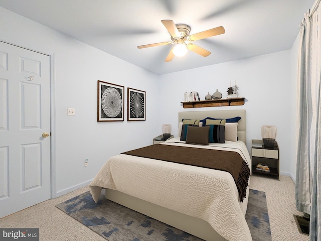 bedroom with light carpet and ceiling fan