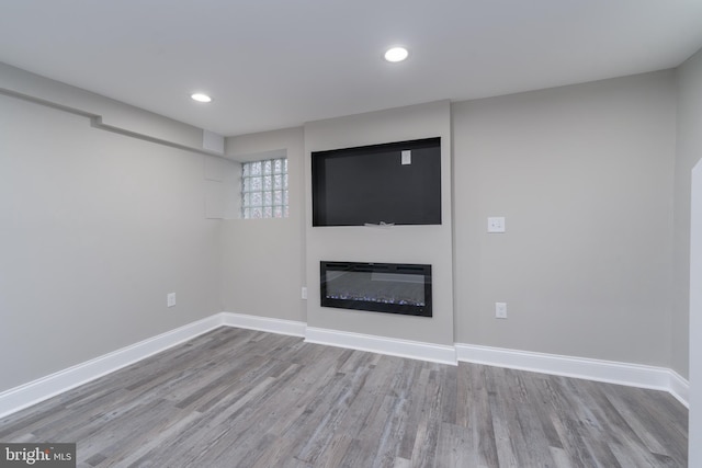 unfurnished living room featuring light hardwood / wood-style floors