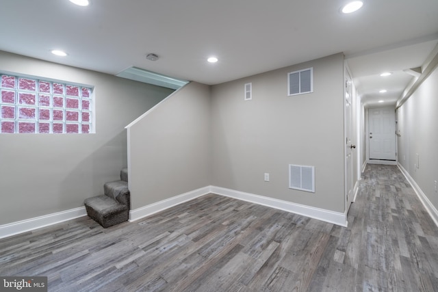 basement featuring hardwood / wood-style floors