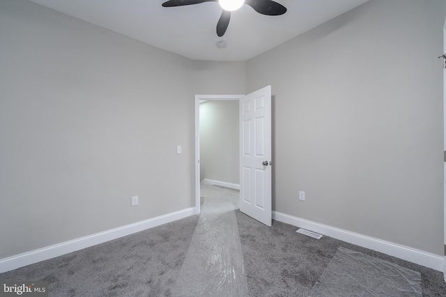 carpeted empty room with ceiling fan