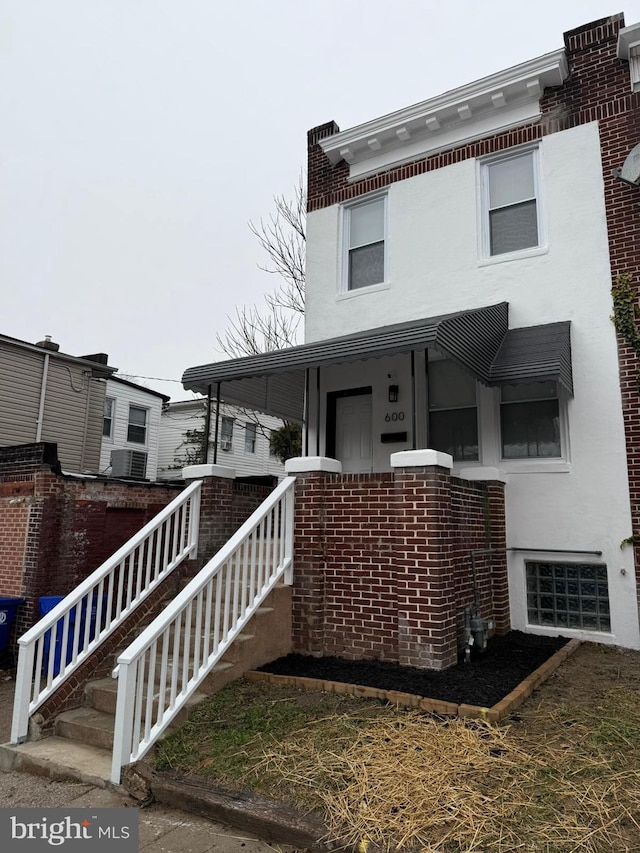 view of front of property with central air condition unit