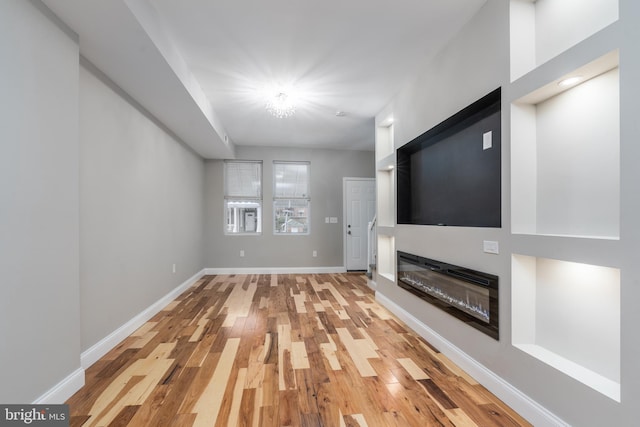 unfurnished living room with light hardwood / wood-style floors