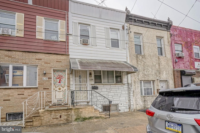 view of front of home with cooling unit