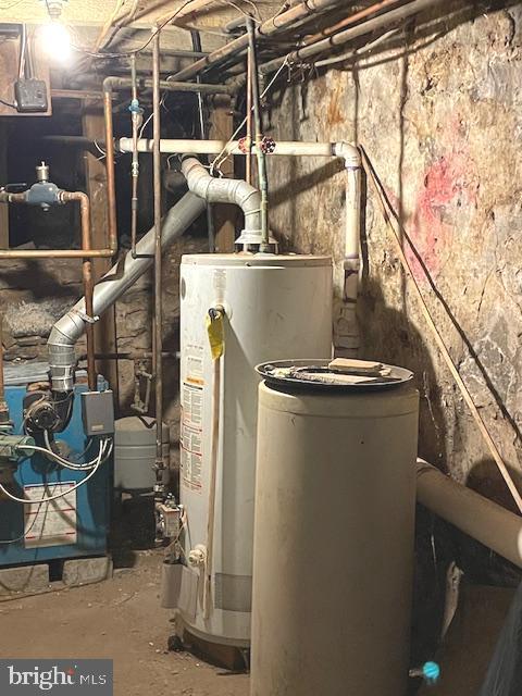 utility room featuring water heater