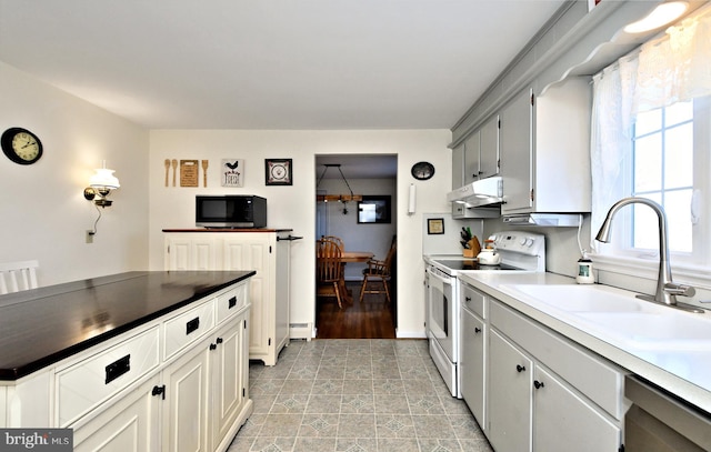 kitchen with sink, a baseboard heating unit, electric stove, dishwashing machine, and white cabinets