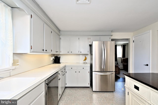 kitchen featuring white cabinetry, sink, and appliances with stainless steel finishes